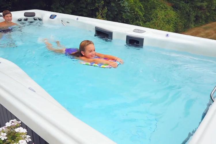 Kids learning to swim in endless pool
